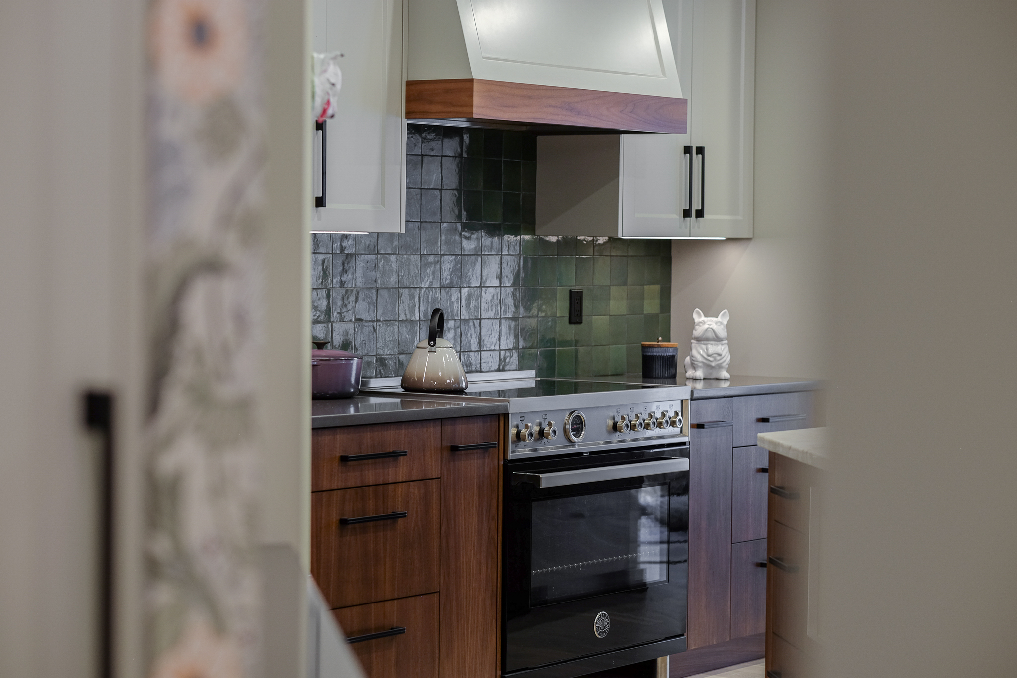 Stylish home with white cabinetry and oak wood finishes.