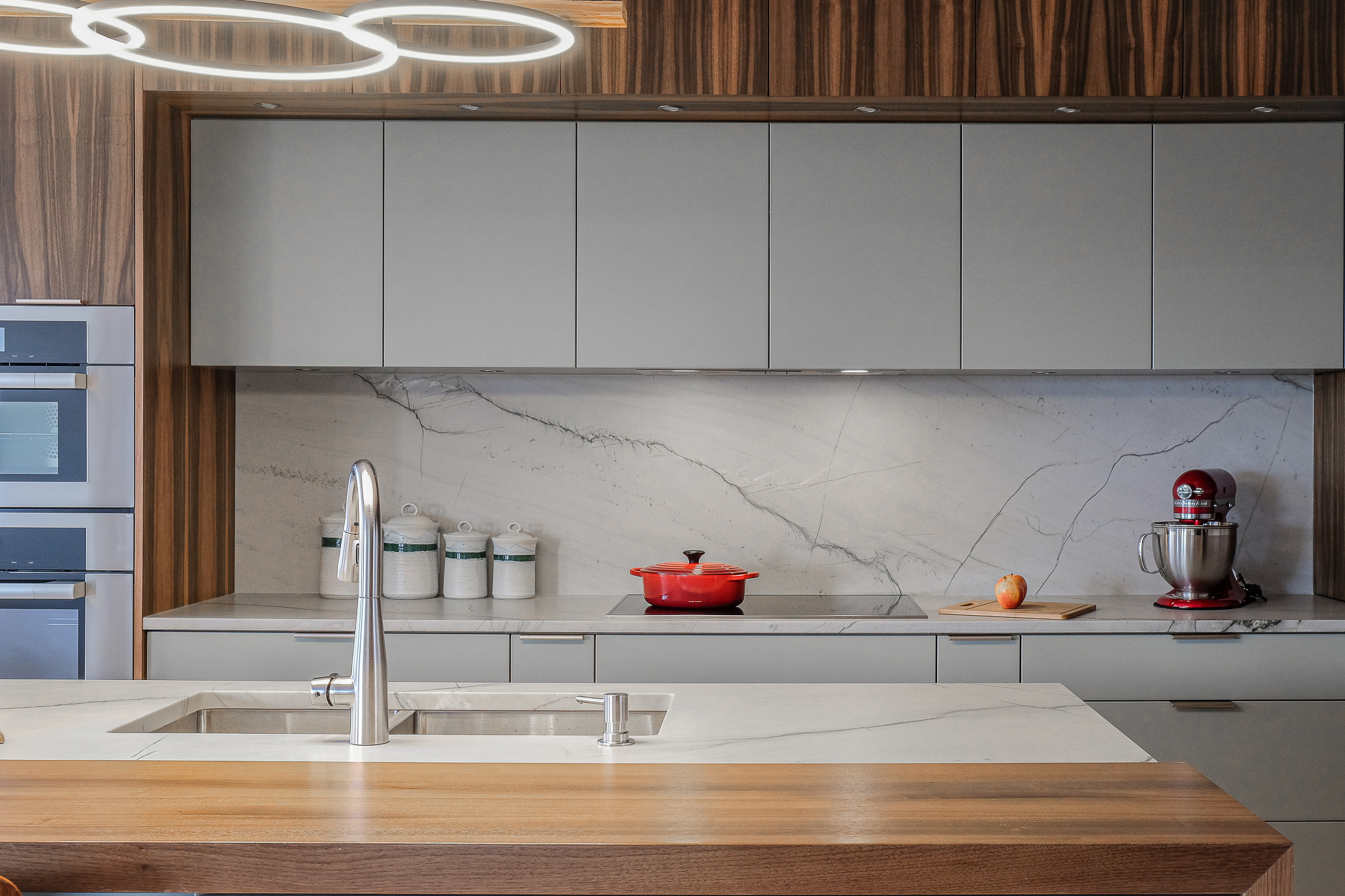 Stylish home with white cabinetry and oak wood finishes.