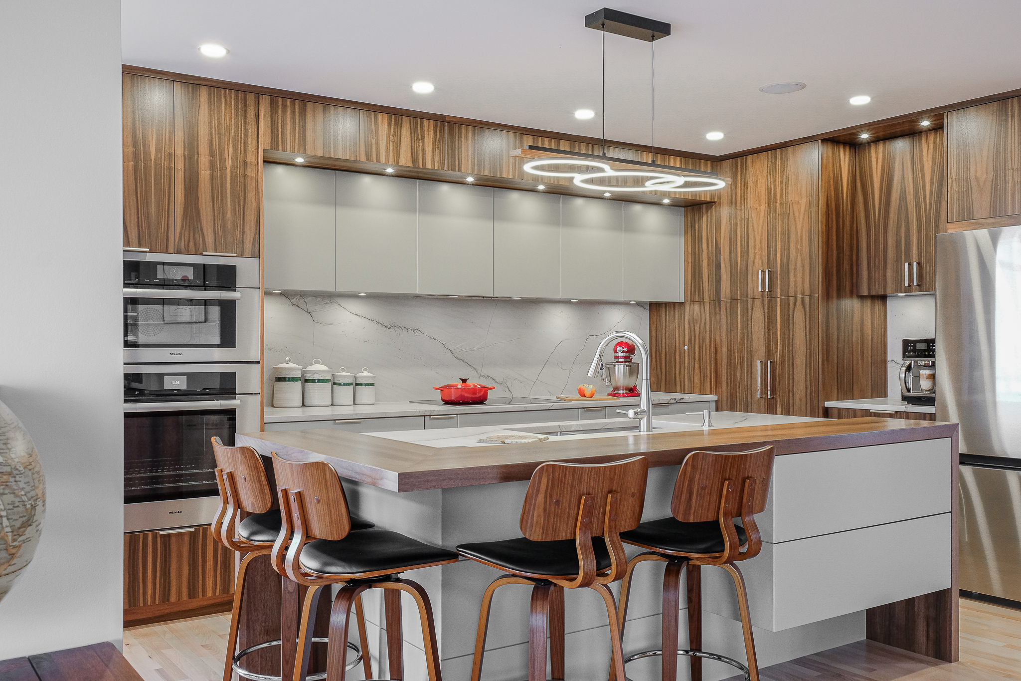 Stylish home with white cabinetry and oak wood finishes.