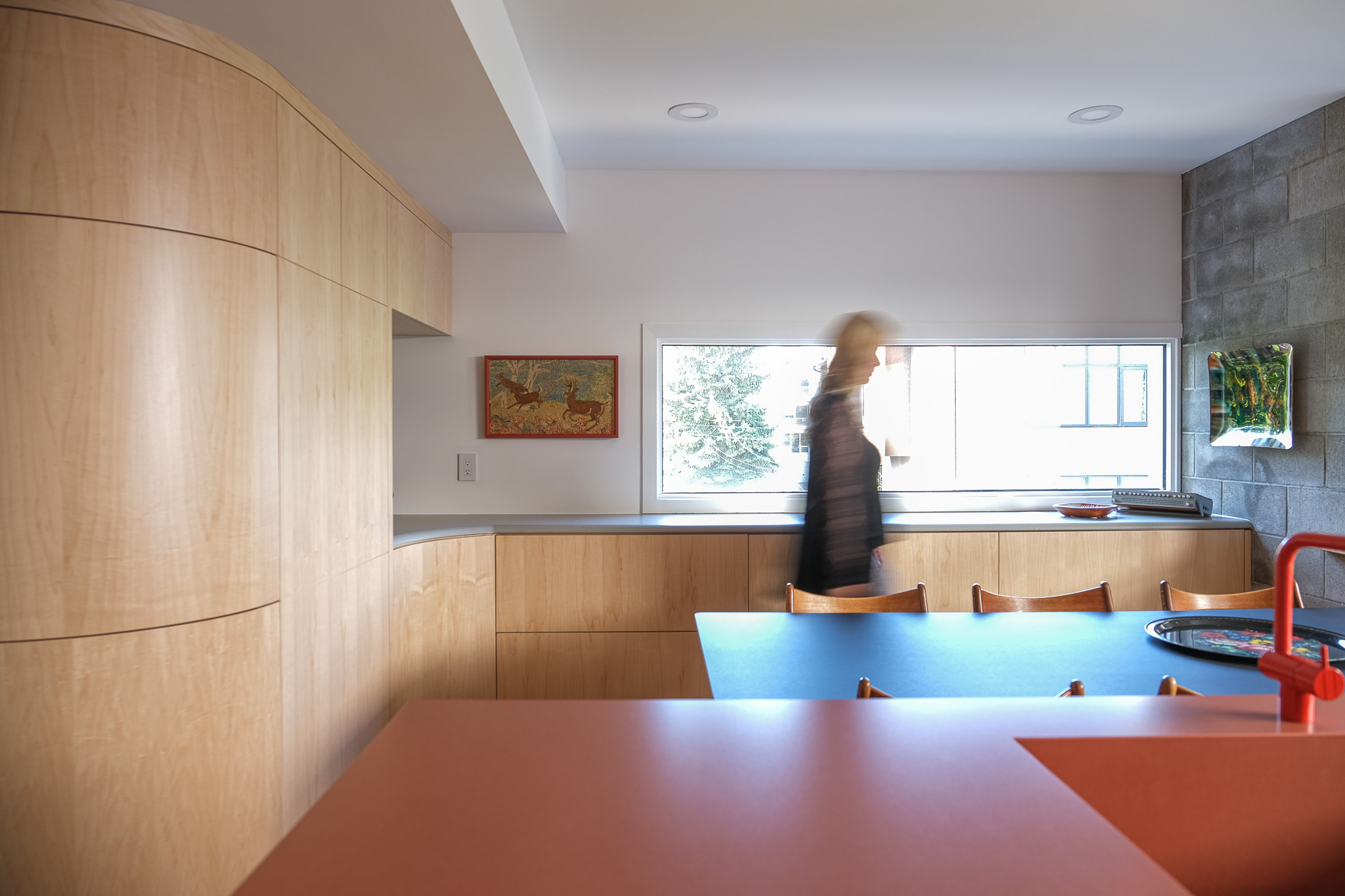 Stylish home with white cabinetry and oak wood finishes.