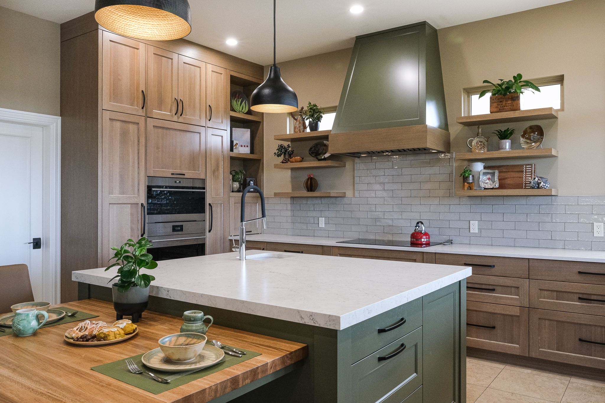 Stylish home with white cabinetry and oak wood finishes.