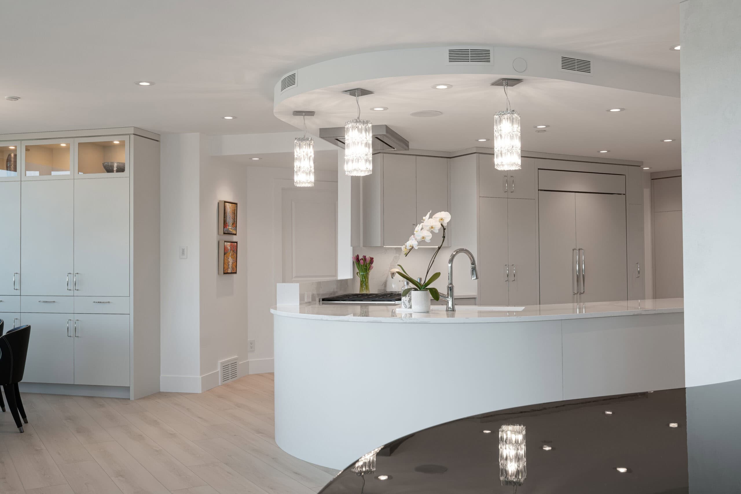 Stylish home with white cabinetry and oak wood finishes.
