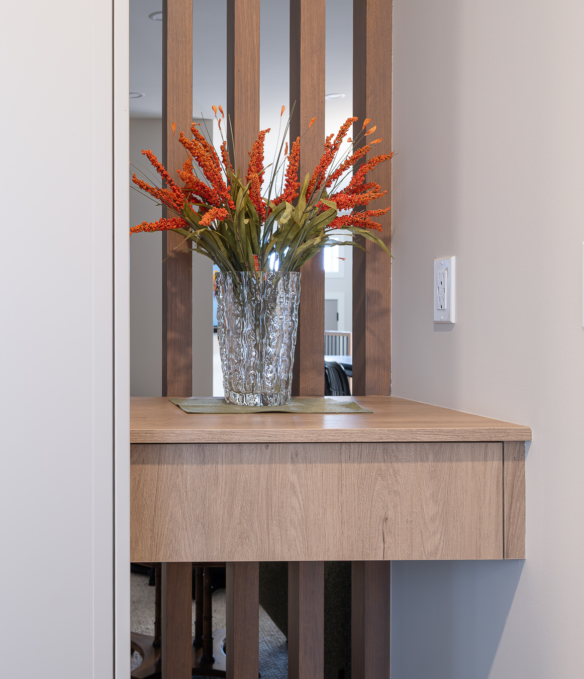 Stylish home with white cabinetry and oak wood finishes.