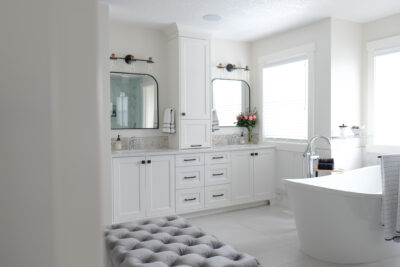 Stylish home with white cabinetry and oak wood finishes.